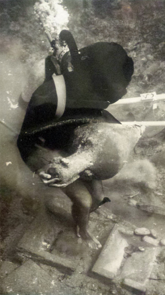 Diver recovering amphora at the shipwreck